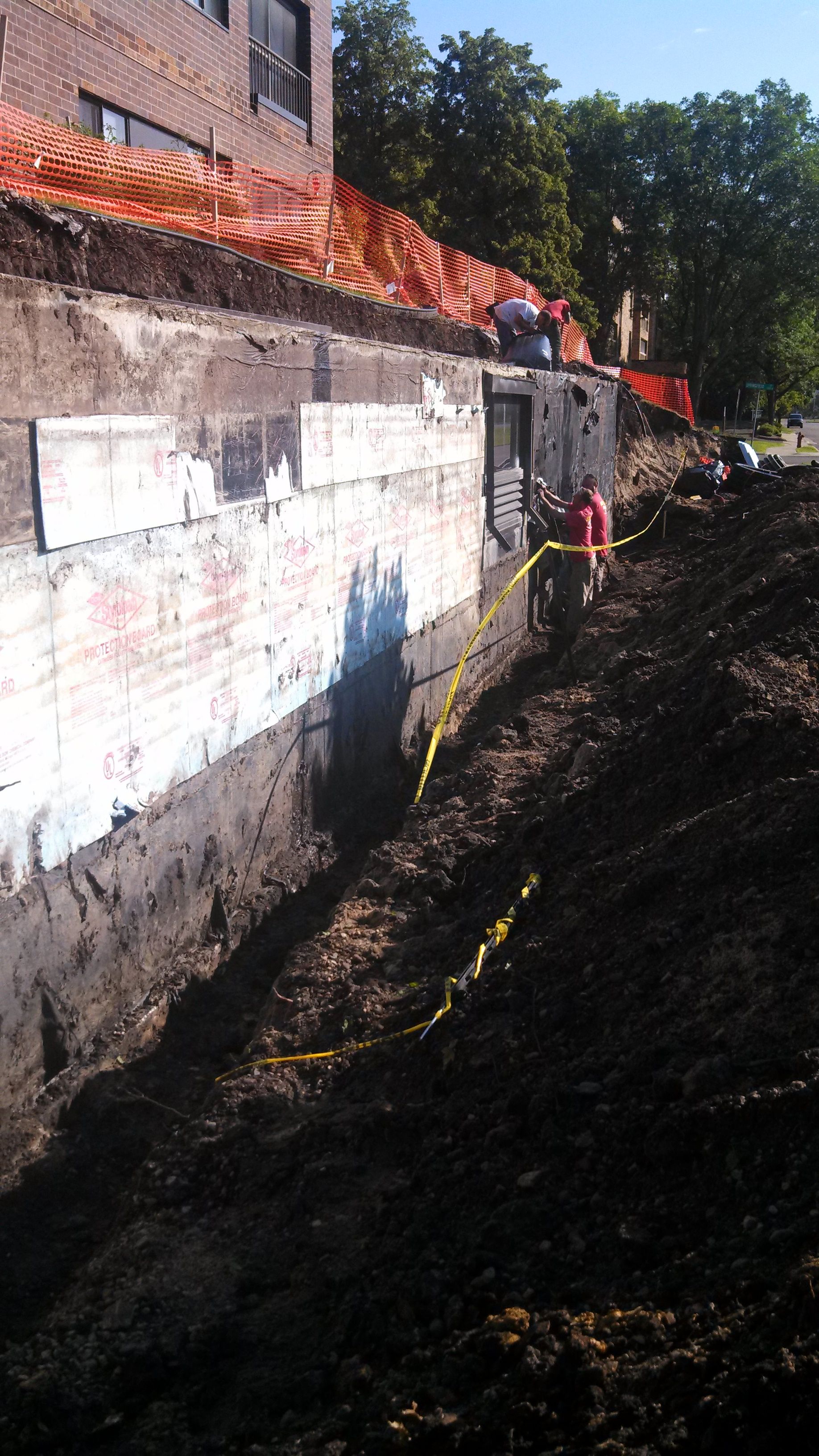 Waterproofing the exterior block of the garage to stop the leaks.